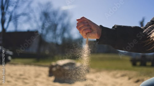 Stunning video capture the moment of hands releasing warm sand, preserving cherished beach memories that evoke nostalgia and the freedom of golden summer sunlight