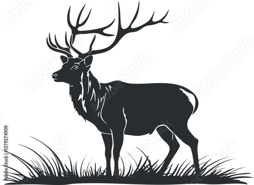 Silhouette of a majestic deer with antlers standing on grass in black and white.