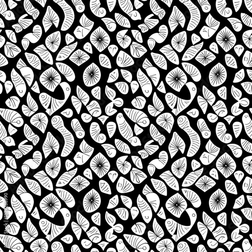 A black and white pattern of leaves and flowers.