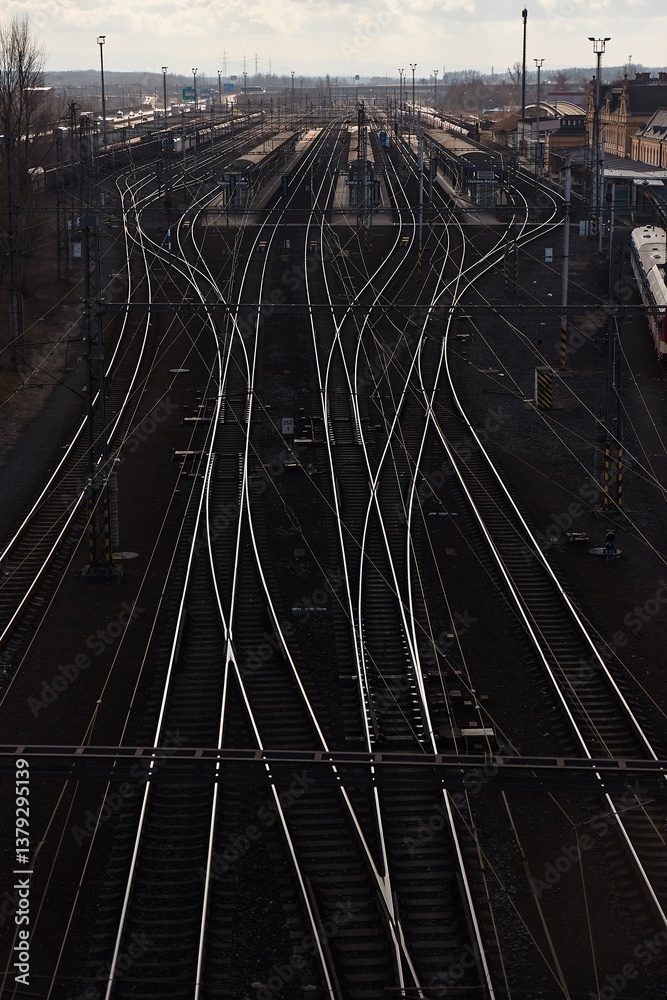 Railway tracks at a station reflecting light