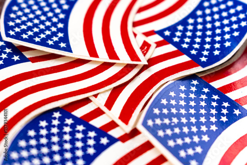 Colorful arrangement of American flag-themed stickers. Represents the essence of national pride and unit