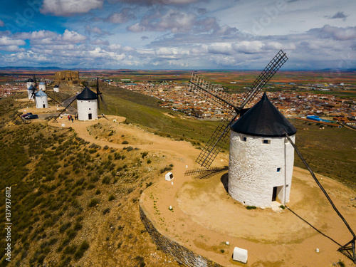 Picturesque rural landscape of Consuegra with famous windmills in sunny day, Spain
