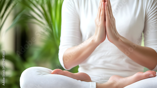 Wallpaper Mural serene yoga pose demonstrating mindfulness. The image shows a person in a meditative lotus position, with hands gently pressed together in prayer Torontodigital.ca