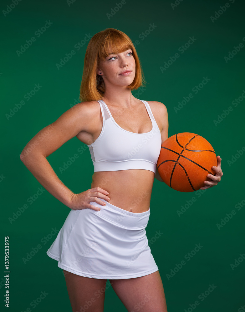 Sports, girl and thinking with basketball in studio for fitness, athletic competition and youth contest with wellness. Female player, green background and ball for training, practice and confidence. Sports, girl and thinking with basketball in studio for fitness, athletic competition and youth contest with wellness. Female player, green background and ball for training, practice and confidence.
