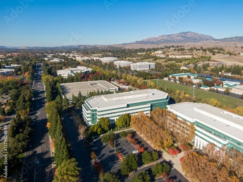 Aerial view of office buildings in San Ramon, California, USA, during autumn. The photo showcases the architecture and landscape of a suburban business park.