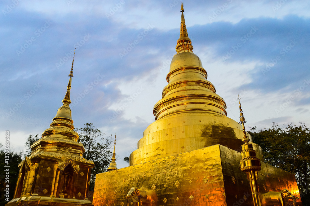Fototapeta premium Golden Pagoda, Lanna Architecture, Symbols of Buddhism, South East Asia at Phra Singh Woramahaviharn Temple, Chiang Mai, Northern Thailand
