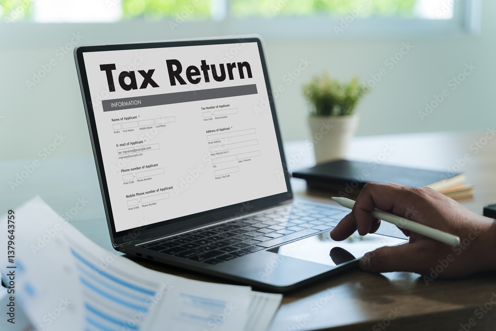 tax return Business person using a laptop Tax season is approaching, and businesses must file their income return online to meet government deadlines, avoid debt, and ensure a refund.