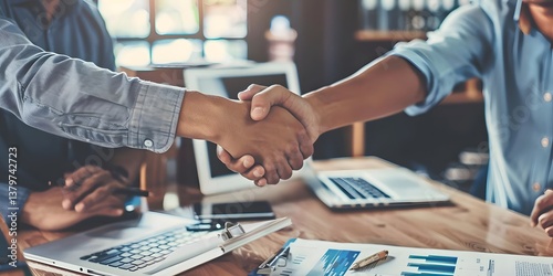 Colleagues Shake Hands, Sealing a Successful Business Deal, Achieving Shared Goals and Objectives, Demonstrating Strong Teamwork, and Fostering Mutual Trust and Respect in the Workplace.