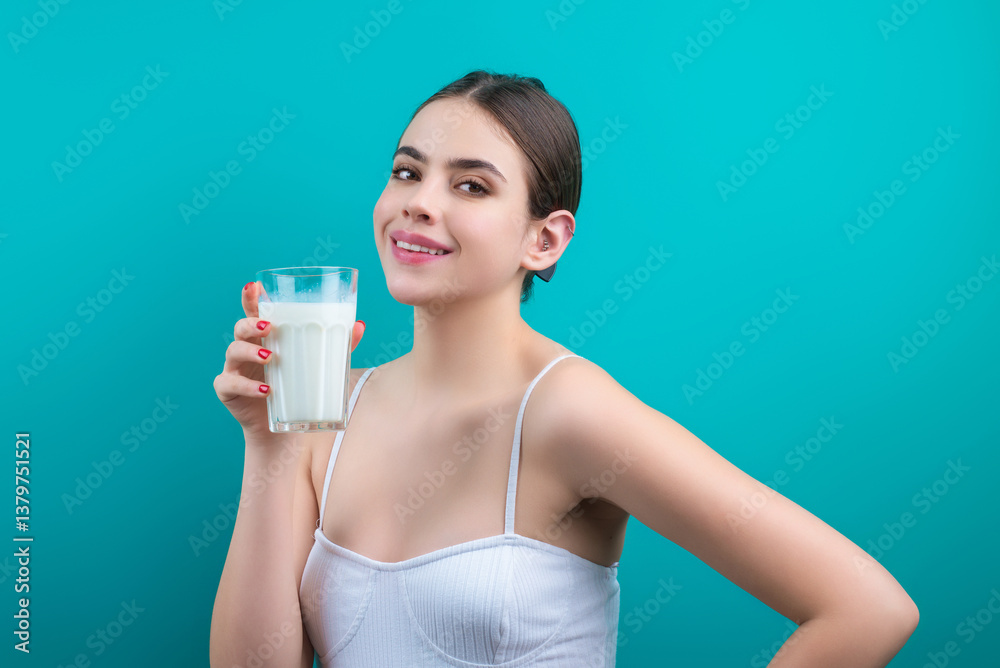 Woman drinking fresh milk. Girl drinking milk , isolated on studio background. Young woman enjoy pure fresh milk. Thirsty woman hold glass milk. Healthy drinking. Woman drinking fresh milk. Girl drinking milk , isolated on studio background. Young woman enjoy pure fresh milk. Thirsty woman hold glass milk. Healthy drinking.
