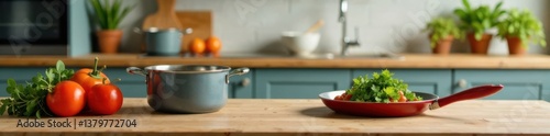 Uncluttered tabletop against a partially defocused kitchen scene with kitchenware and cookware laid out, kitchen organization, modern kitchen decor , tidy workspace