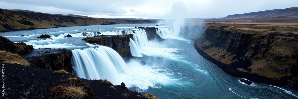 A stunning natural wonder, Hraunfossar is a series of cascading waterfalls flowing from beneath a lava field, nature, outdoor A stunning natural wonder, Hraunfossar is a series of cascading waterfalls flowing from beneath a lava field, nature, outdoor