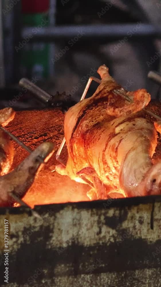 Roasting Ducks Over Open Fire