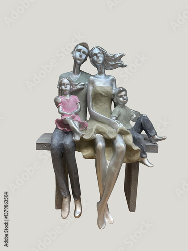  figurine of a young family sitting on a bench