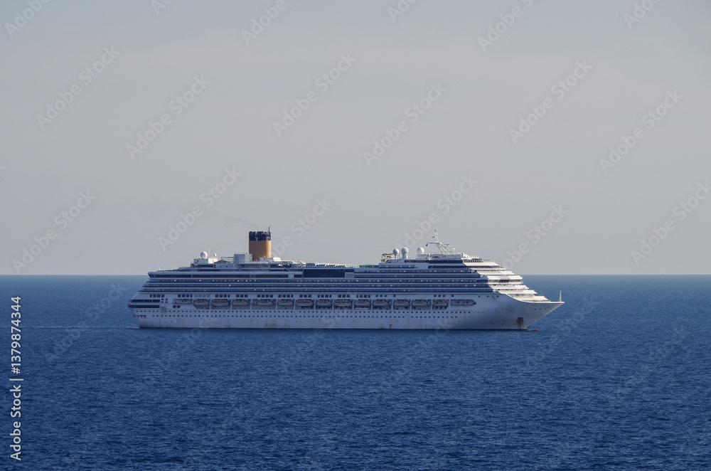 Mega family cruiseship cruise ship liner Pacifica anchored offshore of Civitavecchia Rome, Italy before reactived after Covid pandemic with other vessels in port and coastline