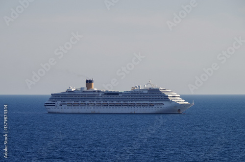 Obraz na płótnie Mega family cruiseship cruise ship liner Pacifica anchored offshore of Civitavecchia Rome, Italy before reactived after Covid pandemic with other vessels in port and coastline w salonie