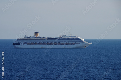 Obraz na płótnie Mega family cruiseship cruise ship liner Pacifica anchored offshore of Civitavecchia Rome, Italy before reactived after Covid pandemic with other vessels in port and coastline w salonie