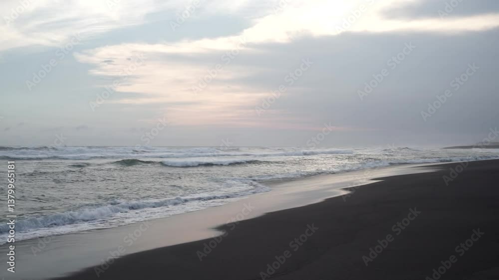 Overcast Beach Scene with Rough Evening Waves Overcast Beach Scene with Rough Evening Waves