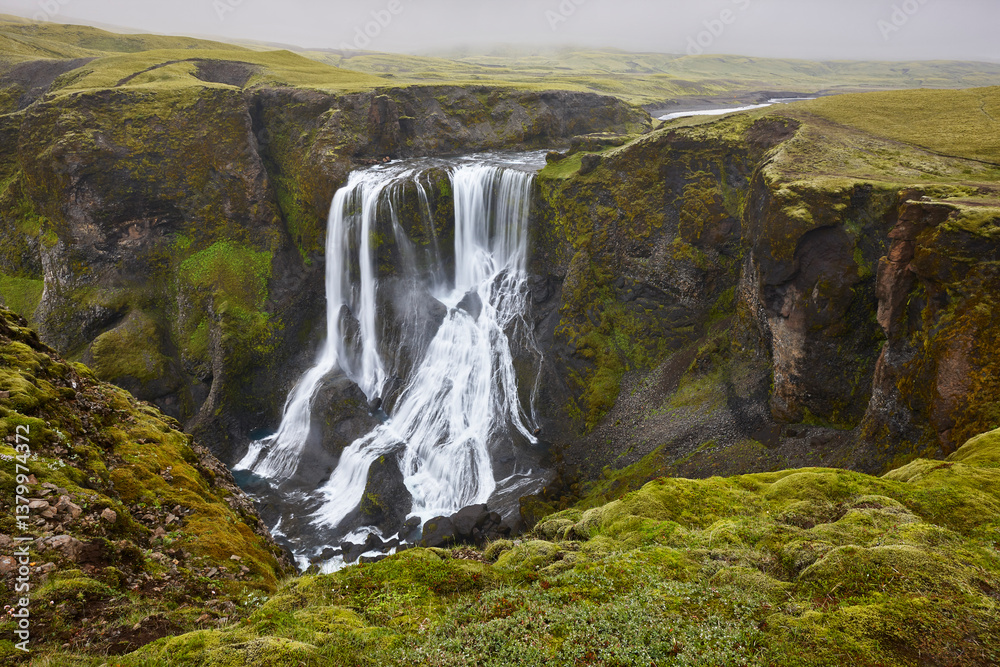 Fagrifoss waterfall. Mossy rocky landscape in Lakagigar. South area. Iceland
