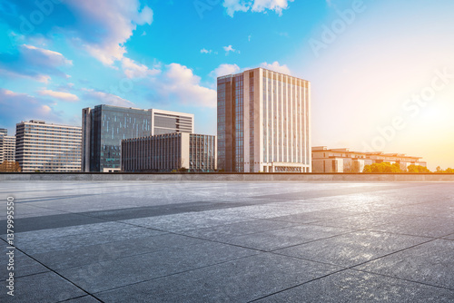 Obraz na płótnie Empty square floor with modern cityscape and office buildings background during sunrise w salonie