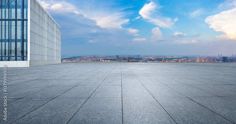 Empty square floor on a rooftop overlooking the cityscape