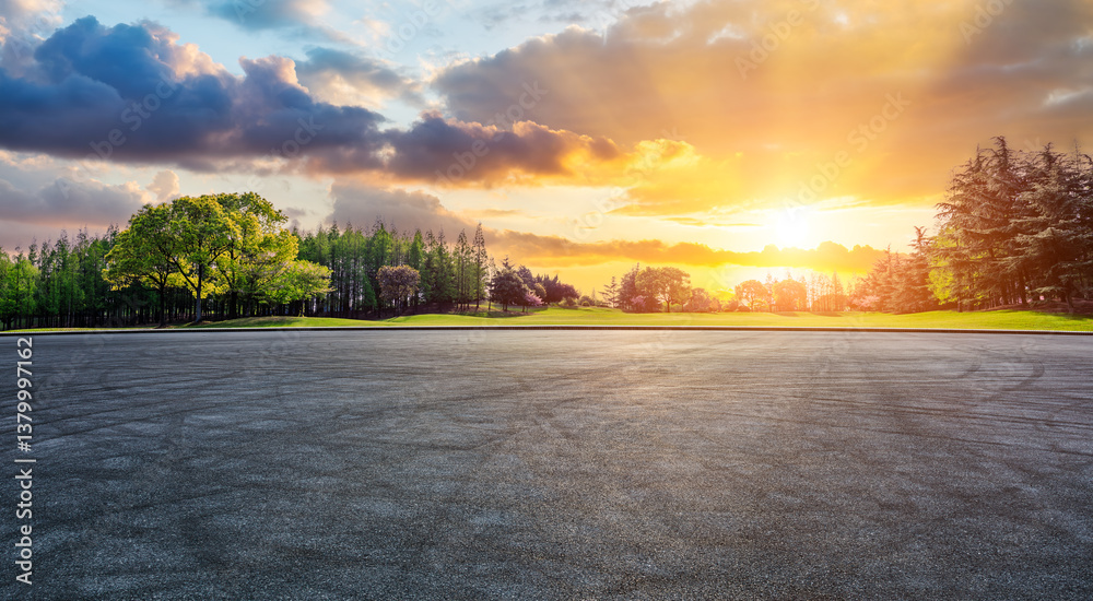 Empty asphalt road ground and lush green trees scenery at sunset