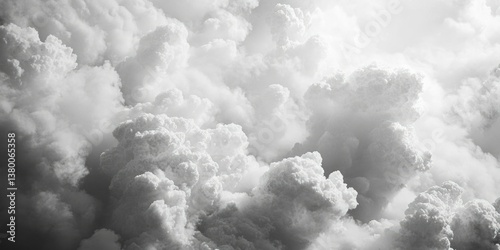 Dark and light grayscale image of cloudy sky, showing a dramatic contrast between the two halves.