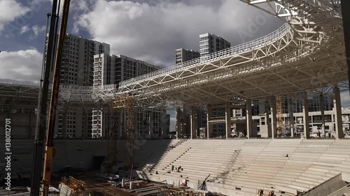 A modern stadium is actively being built in the city, boosting community spirit