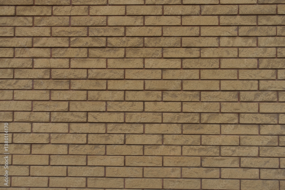 Naklejka premium Backdrop - beige split face brick veneer wall with running bond layout