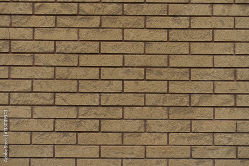 Fototapeta Naklejka Na Ścianę i Meble -  Texture of beige split face brick veneer wall with running bond layout