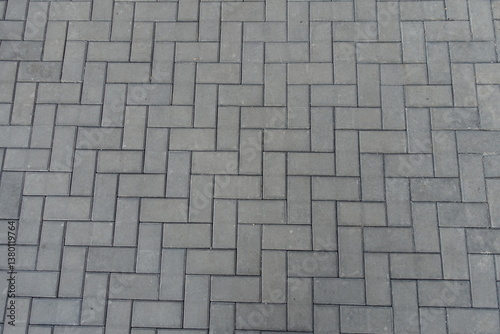 Obraz na płótnie Backdrop - grey concrete pavement with single herringbone layout w salonie