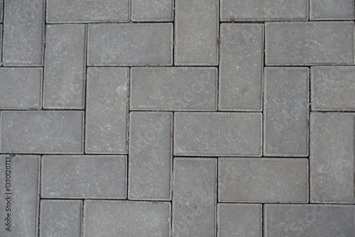 Obraz na płótnie Closeup of grey concrete pavement with single herringbone layout w salonie