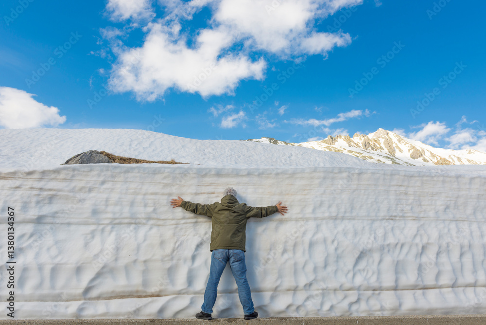 custom made wallpaper toronto digitalMan Leaning on a Snow Wall with Arms Outstretched in Uri, switzerland.