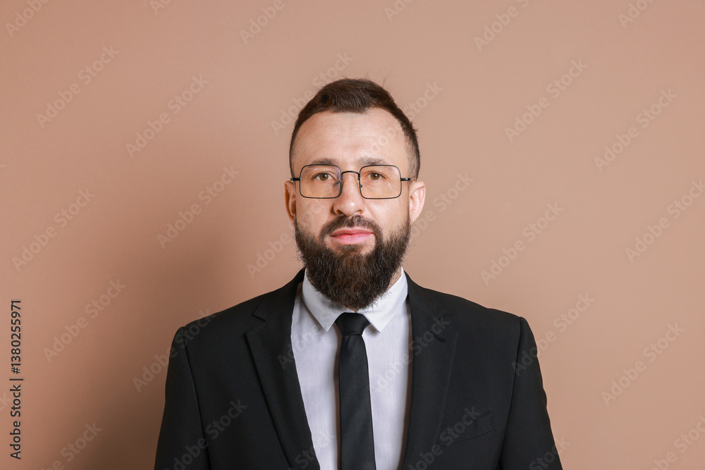 Handsome bearded man in suit on brown background Handsome bearded man in suit on brown background