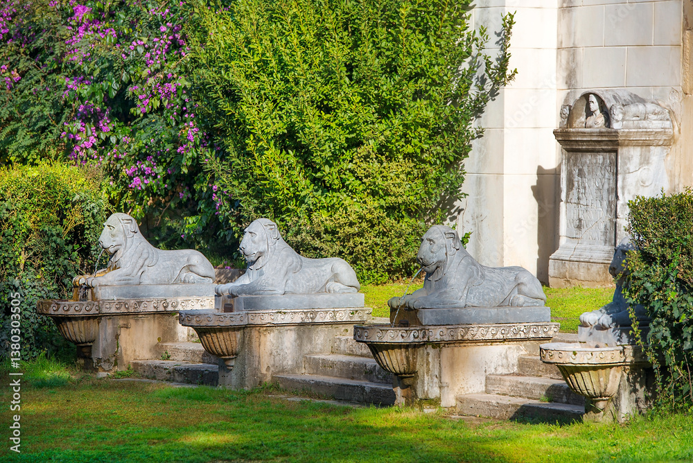 Villa Borghese gardens, Portico dei Leoni, stone lion sculptures in front of the entrance, Rome, Italy