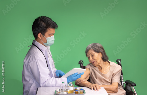 Photography Chroma key, nurse doing vaccine injection to senior woman.