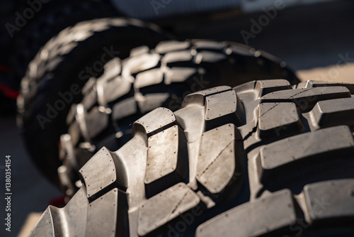 Industrial rubber tyre patterns close up next types next toe each other. Comparing tire patterns photo