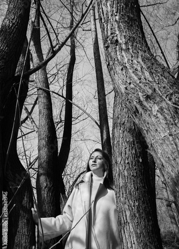A young woman among the trees