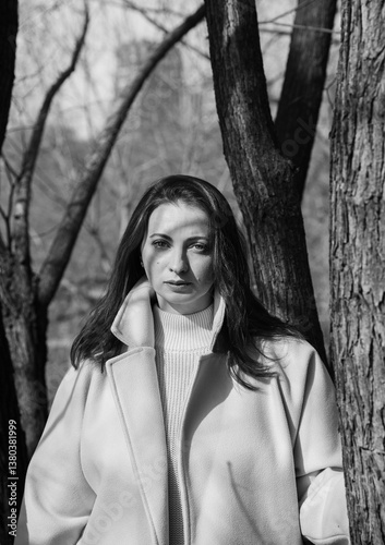A young woman among the trees