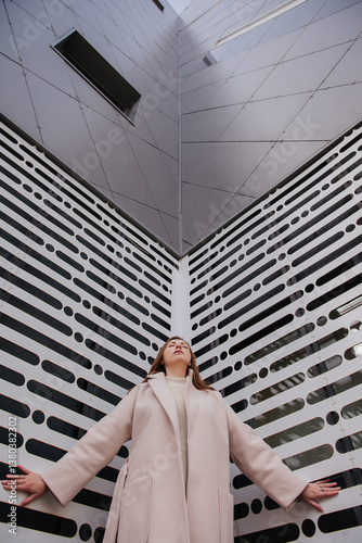 A young woman on the background of a wall