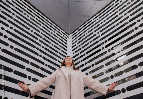 A young woman on the background of a wall