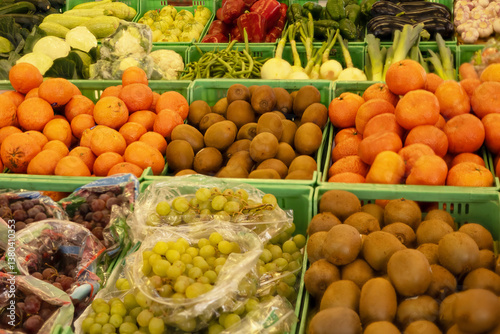 Fresh fruit and vegetables displayed in a neighborhood fruit shop