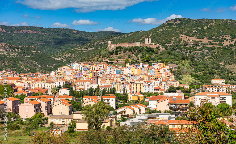 Fototapeta premium Panoramic view of the colorful buildings of Bosa and the Castle of Serravalle. Oristano, Sardinia, Italy