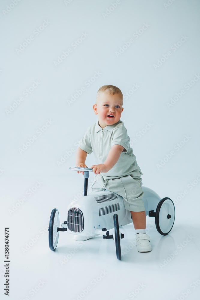An adorable toddler joyfully riding a classic toy car in a bright, minimalist studio setting, capturing the essence of carefree childhood adventure and vibrant imagination through playful exploration An adorable toddler joyfully riding a classic toy car in a bright, minimalist studio setting, capturing the essence of carefree childhood adventure and vibrant imagination through playful exploration