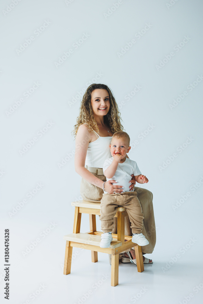 Joyful Mother and Baby Portrait A Studio Session that Captures Beautiful and Tender Moments Between a Loving Mother and Her Precious Child, Highlighting the Deep Affection and Connection They Share