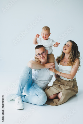 Obraz na płótnie Joyful Family Portrait A Heartwarming Moment Captured in a Bright and Lightfilled Studio Setting, Showcasing the Love and Connection Among Family Members all Together at This Beautiful Time w salonie
