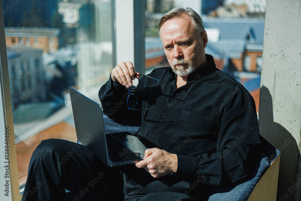 In a chic, elegant workspace, a professional works on their laptop. The environment fosters concentration and productivity, creating a sophisticated atmosphere that inspires creativity and motivation