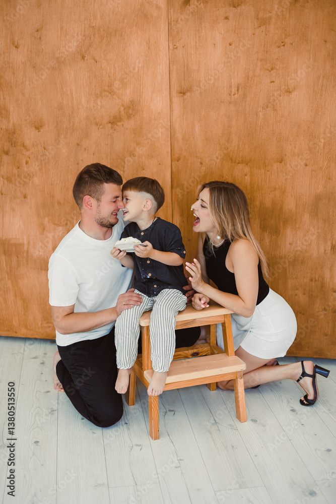 Family Portrait Capturing Joyful, Beautiful Moments with Parents and Their Child in a Stylish, Warm Indoor Setting That Reflects Love and Unity, Emphasizing Bonding and Togetherness