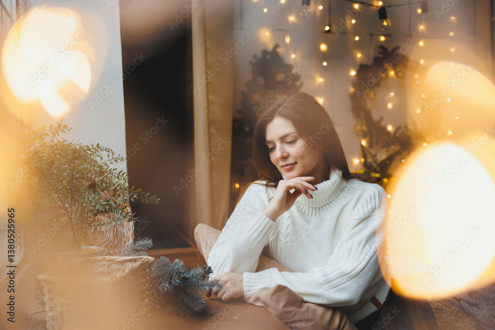 Cute girl in New Year's locations in a cozy living room. Woman at home for the new year.