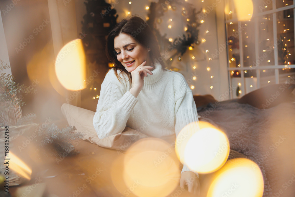 Cute girl in New Year's locations in a cozy living room. Woman at home for the new year.