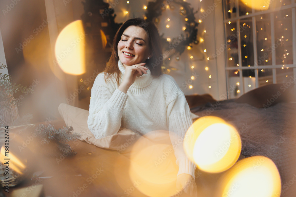 Cute girl in New Year's locations in a cozy living room. Woman at home for the new year.